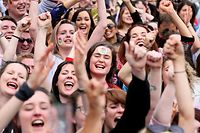 TOPSHOT - Yes campaigners react as they wait for the official result of the Irish abortion referendum, at Dublin Castle in Dublin on May 26, 2018. 
Irish Prime Minister Leo Varadkar  hailed a "quiet revolution" on Saturday as this traditionally Catholic country looked set to liberalise some of Europe's strictest abortion laws in a historic landslide referendum vote. / AFP PHOTO / Paul FAITH