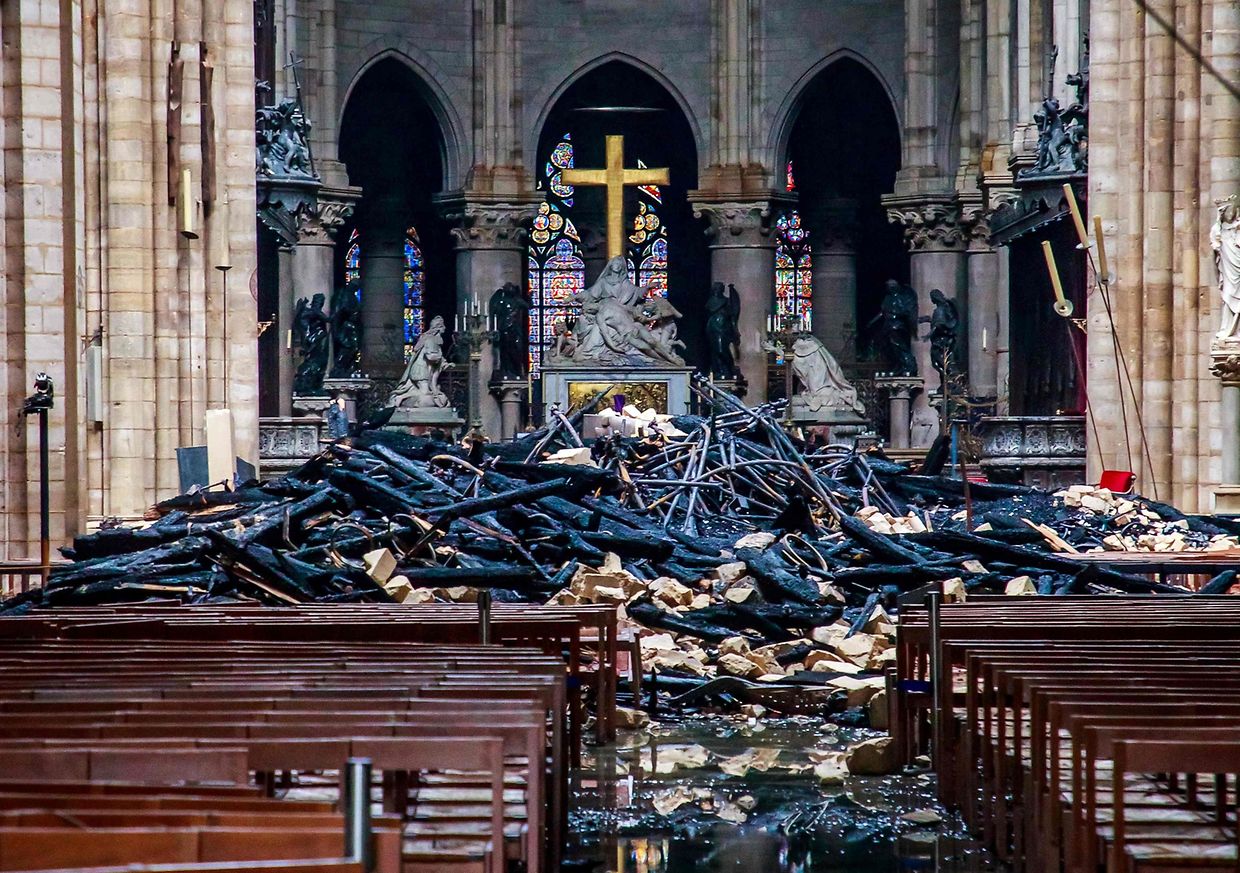(FILES) This file photo taken on April 16, 2019 shows debris inside the Notre-Dame-de Paris Cathedral in Paris, a day after a fire that devastated the building in the centre of the French capital. - April 15, 2021 marks the two years anniversary of the fire that devastated Notre-Dame-de-Paris Cathedral, in the centre of the French capital. (Photo by Christophe PETIT TESSON / POOL / AFP)