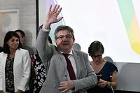 France's leftist La France Insoumise (LFI) party leader, Member of Parliament and leader of left-wing coalition Nupes (Nouvelle Union Populaire Ecologique et Sociale - New Ecologic and Social People's Union) Jean-Luc Melenchon waves during the election evening at the Nupes headquarters, following the first round of France's parliamentary elections in Paris, on June 12, 2022. - The united left (25% to 26.2%) and President Macron's camp (25% to 25.8%) came neck and neck in the first round of legislative elections on June 12, 2022, against a backdrop of record abstention (52.1% to 52.8%), opening up the game for the second round in a week. (Photo by STEPHANE DE SAKUTIN / AFP)