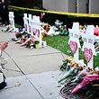 People pay their respects at a memorial outside the Tree of Life synagogue after a shooting there left 11 people dead in the Squirrel Hill neighborhood of Pittsburgh, Pennsylvania on October 29, 2018. - Mourners held an emotional vigil Sunday for victims of a fatal shooting at a Pittsburgh synagogue, an assault that saw a gunman who said he "wanted all Jews to die" open fire on a mostly elderly group. Americans had earlier learned the identities of the 11 people killed in the brutal assault at the Tree of Life synagogue, including 97-year-old Rose Mallinger and couple Sylvan and Bernice Simon, both in their 80s.Nine of the victims were 65 or older. (Photo by Brendan Smialowski / AFP)