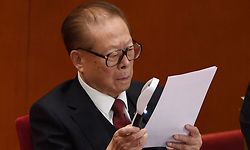 (FILES) In this file photo taken on October 24, 2017, China's former president Jiang Zemin reads a report during the closing session of the 19th Communist Party Congress at the Great Hall of the People in Beijing. - China's former leader Jiang Zemin, who steered the country through a transformational era from the late 1980s and into the new millennium, died November 30, 2022 at the age of 96, Xinhua reported. (Photo by Greg Baker / AFP)