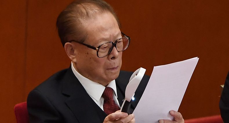(FILES) In this file photo taken on October 24, 2017, China's former president Jiang Zemin reads a report during the closing session of the 19th Communist Party Congress at the Great Hall of the People in Beijing. - China's former leader Jiang Zemin, who steered the country through a transformational era from the late 1980s and into the new millennium, died November 30, 2022 at the age of 96, Xinhua reported. (Photo by Greg Baker / AFP)