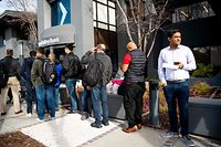 Silicon Valley Bank customers wait in line at SVB�s headquarters in Santa Clara, California on March 13, 2023. - US President Biden sought to reassure Americans over the country's banking system on Monday, while insisting emergency measures would not be paid for by taxpayers, as additional banks came under stress following the collapse of Silicon Valley Bank last week, the second largest bank failure in history, and New York regulators took control of Signature Bank on Sunday. (Photo by NOAH BERGER / AFP)