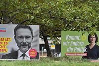 Billboards with election campaign posters showing (L-R) Free Democratic Party (FDP) leader Christian Lindner and the three chancellor candidates in the the September 26 federal election, co-leader of Germany's Greens (Die Gruenen) Annalena Baerbock, German Finance Minister and Vice-Chancellor of the Social Democratic SPD Party Olaf Scholz and Christian Democratic Union CDU leader Armin Laschet are seen in Berlin on September 25, 2021. - The campaign poster featuring Laschet has been defaced as the slogan reads "Shot dead for Germany" instead of "Determined for Germany". (Photo by John MACDOUGALL / AFP)