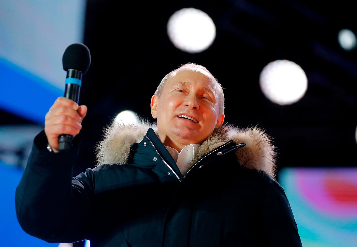 Russian president Vladimir Putin addresses the crowd (AFP)