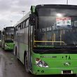 TOPSHOT - Buses which will be used to evacuate civilians leaving from rebel-held areas of Aleppo are seen waiting on December 14, 2016. 
Thousands of cold and hungry civilians crowded the streets of Aleppo uncertain of their future after their planned evacuation from the last rebel pocket of the city was delayed.

 / AFP PHOTO / George OURFALIAN