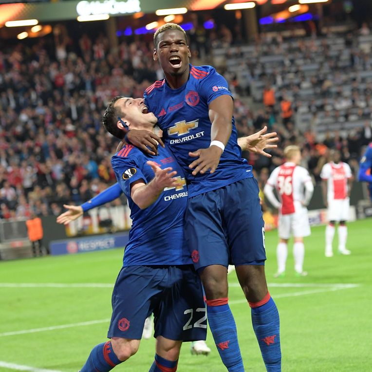 Football Soccer - Ajax Amsterdam v Manchester United - UEFA Europa League Final - Friends Arena, Solna, Stockholm, Sweden - 24/5/17 Henrikh Mkhitaryan (L) of Manchester United celebrates a goal with teammate Paul Pogba. Anders Wiklund/TT NEWS AGENCY/via REUTERSATTENTION EDITORS - THIS IMAGE WAS PROVIDED BY A THIRD PARTY. FOR EDITORIAL USE ONLY. NOT FOR SALE FOR MARKETING OR ADVERTISING CAMPAIGNS. THIS PICTURE IS DISTRIBUTED EXACTLY AS RECEIVED BY REUTERS, AS A SERVICE TO CLIENTS. SWEDEN OUT. NO COMMERCIAL OR EDITORIAL SALES IN SWEDEN. NO COMMERCIAL SALES.