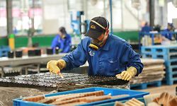 This photo taken on March 30, 2020 shows employees working on a battery production line at a factory in Huaibei in China's eastern Anhui province. - Factory activity in China rebounded in March from a record low, according to official data released on March 31, returning to expansion territory while the coronavirus pandemic continues to devastate the global economy. (Photo by STR / AFP) / China OUT