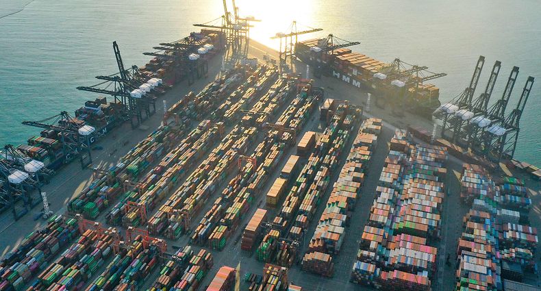 This aerial photo taken on December 25, 2022 shows cranes and shipping containers at Yantian Port in Shenzhen, in China's southern Guangdong province. (Photo by AFP) / China OUT