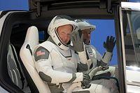 TOPSHOT - This handout photo released by NASA shows NASA astronauts Douglas Hurley, left, and Robert Behnken, wearing SpaceX spacesuits, are seen as they depart the Neil A. Armstrong Operations and Checkout Building for Launch Complex 39A during a dress rehearsal prior to the Demo-2 mission launch, Saturday, May 23, 2020, at NASA�s Kennedy Space Center in Florida. - NASA�s SpaceX Demo-2 mission is the first launch with astronauts of the SpaceX Crew Dragon spacecraft and Falcon 9 rocket to the International Space Station as part of the agency�s Commercial Crew Program. launch, Saturday, May 23, 2020, at NASA�s Kennedy Space Center in Florida. NASA�s SpaceX Demo-2 mission is the first launch with astronauts of the SpaceX Crew Dragon spacecraft and Falcon 9 rocket to the International Space Station as part of the agency�s Commercial Crew Program. The test flight serves as an end-to-end demonstration of SpaceX�s crew transportation system. Behnken and Hurley are scheduled to launch at 4:33 p.m. EDT on Wednesday, May 27, from Launch Complex 39A at the Kennedy Space Center. A new era of human spaceflight is set to begin as American astronauts once again launch on an American rocket from American soil to low-Earth orbit for the first time since the conclusion of the Space Shuttle Program in 2011. (Photo by Bill INGALLS / NASA / AFP) / RESTRICTED TO EDITORIAL USE - MANDATORY CREDIT "AFP PHOTO /NASA/Bill Ingalls  " - NO MARKETING - NO ADVERTISING CAMPAIGNS - DISTRIBUTED AS A SERVICE TO CLIENTS