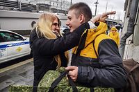A girlfriend of Roman, 30, hugs him, as he was drafted in the morning, and released at noon at a recruiting station in central Moscow on October 17, 2022. - Army draft offices were closed in Moscow on October 17, 2022, at 2:00 pm, (1100 GMT) as the Kremlin's quotas for recruiting reservists to fight in Ukraine have been met in the capital, city Mayor Sergei Sobyanin announced. (Photo by Alexander NEMENOV / AFP)