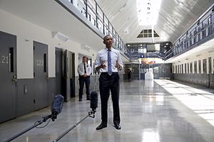 U.S. President Barack Obama speaks to reporters during his visit to the El Reno Federal Correctional Institution outside Oklahoma City in this July 16, 2015 file photo. In April 2014, the administration of President Barack Obama announced the most ambitious clemency program in 40 years, inviting thousands of jailed drug offenders and other convicts to seek early release and urging lawyers across the country to take on their cases. Nearly two years later the program is struggling under a deluge of unprocessed cases, sparking concern within the administration and among justice reform advocates over the fate of what was meant to be legacy-defining achievement for Obama. To match Insight USA-JUSTICE/CLEMENCY REUTERS/Kevin Lamarque/Files