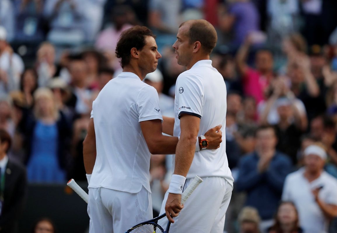 Tennis - Wimbledon - London, Britain - July 10, 2017   Luxembourg’s Gilles Muller with Spain’s Rafael Nadal after winning their fourth round match   REUTERS/Matthew Childs