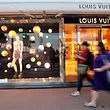 People walk past a store of the Louis Vuitton brand in Cannes, France, October 16, 2016. REUTERS/Eric Gaillard