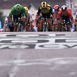 TOPSHOT - Netherlands' Dylan Groenewegen (C) sprints with Slovakia's Peter Sagan (2ndL), wearing the best sprinter's green jersey,and Australia's Caleb Ewan (L) to win on the finish line of the seventh stage of the 106th edition of the Tour de France cycling race between Belfort and Chalon-sur-Saone, in Chalon-sur-Saone, eastern France, on July 12, 2019. (Photo by Marco Bertorello / AFP)