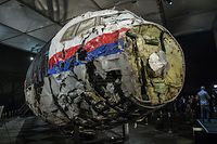 The reconstructed wreckage of the MH17 airplane is seen after the presentation of the final report into the crash of July 2014 of Malaysia Airlines flight MH17 over Ukraine, in Gilze Rijen, the Netherlands, October 13, 2015. The Dutch are due to announce on Wednesday 28 September the long-awaited results of an investigation with Australia, Malaysia, Belgium and Ukraine into the July 17, 2014 downing of the flight.    REUTERS/Michael Kooren/File Photo          FROM THE FILES PACKAGE - SEARCH "FILES MH17" FOR ALL 20 IMAGES