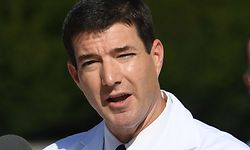 TOPSHOT - White House physician Sean Conley (C) answers questions surrounded by other doctors, during an update on the condition of US President Donald Trump, on October 5, 2020, at Walter Reed Medical Center in Bethesda, Maryland. - President Donald Trump announced that he is leaving the hospital where he was given emergency treatment for Covid-19 and told the nation, where the virus has killed almost 210,000 people this year, that they have nothing to worry about. (Photo by SAUL LOEB / AFP)