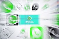 (FILES) In this file photo taken on March 22, 2018 This photo illustration shows Whatsapp logos on a screen in Kuala Lumpur. - Facebook-owned mobile messaging platform WhatsApp announced on January 21, 2019 it was restricting how many times any given message can be forwarded in an effort to boost privacy and security. (Photo by Manan VATSYAYANA / AFP)