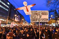 TOPSHOT - Protesters holds placards during a rally under the slogan "For a Decent Slovakia", against corruption and to pay tribute to murdered Slovak journalist Jan Kuciak and his fiancee Martina Kusnirova on March 9, 2018 at the Slovak National Uprising (SNP) square in Bratislava, Slovakia. 
Demonstrations were expected to be held in dozens of Slovak cities and also abroad after the murder of investigative journalist Jan Kuciak, who was probing alleged high-level political corruption  / AFP PHOTO / JOE KLAMAR