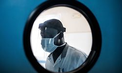 A Doctor wears a protective mask inside the emergency ward in Pikine Hospital in Dakar on April 23, 2020. - As COVID-19 coronavirus cases slowly increase in Senegal, hospitals are preparing to receive and test suspect cases whilst safely treating their normal patients. (Photo by JOHN WESSELS / AFP)