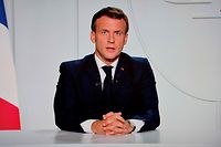 French President Emmanuel Macron is seen on a TV screen in Paris on October 28, 2020, as he delivers an evening televised address to the nation, to announce new measures aimed curbing the spread of the Covid-19 pandemic, caused by the novel coronavirus. - France was preparing on October 28 for tough new restrictions to halt a flare-up in Covid-19 cases that has alarmed doctors, with a second lockdown widely mooted as hospitals battle an influx of patients. (Photo by Ludovic MARIN / AFP)