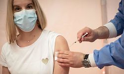 A patient receives a dose of the Pfizer-BioNTech vaccine at the temporary Covid-19 vaccination centre in a gymnasium in Saint-Maur-des-Foss�s, outside Paris, on May 31, 2021. (Photo by BERTRAND GUAY / AFP)