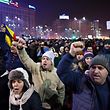 People demonstrate in front of Romanian Government headquarters against controversial decrees to pardon corrupt politicians and decriminalize other offenses, on January 31, 2017 in Bucharest. 
Thousands of Romanians rally spontaneously in the front of government after a controversial law giving pardon to corruption crimes was adopted  by emergency order late evening on January 31, 2017. / AFP PHOTO / DANIEL MIHAILESCU