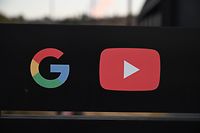 (FILES) In this file photo taken on November 21, 2019 (FILES) the Google and YouTube logos are seen at the entrance to the Google offices in Los Angeles, California. - YouTube said May 26, 2020 it was investigating the removal of comments critical of the Chinese Communist Party from the video-sharing platform, saying the filtering appeared to be "an error." (Photo by Robyn Beck / AFP)
