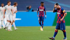 Barcelona's Argentinian forward Lionel Messi (R) reacts after Bayern Munich's second goal during the UEFA Champions League quarter-final football match between Barcelona and Bayern Munich at the Luz stadium in Lisbon on August 14, 2020. (Photo by Manu Fernandez / POOL / AFP)
