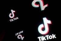 (FILES) This file photo taken on January 21, 2021 in Nantes, western France shows the screen of a smartphone displaying the logo of Chinese social network Tik Tok. - The European Commission has banned TikTok on official devices used by staff amid concerns over data protection, a spokesperson told AFP on February 23, 2023, meaning also that European Commission staff cannot use the Chinese-owned video-sharing app on personal devices including phones that have official apps installed, the spokesperson said, confirming a report by news website EURACTIV. (Photo by LOIC VENANCE / AFP)