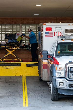 NEW YORK, NY - APRIL 7: A person is transported from an ambulance to the emergency room at Wyckoff Heights Medical Center on April 7, 2020 in New York, United States. Gov. Andrew M. Cuomo said on Tuesday in his daily briefing that 731 people had died since the prior day of the virus, the states highest one-day total   David Dee Delgado/Getty Images/AFP
== FOR NEWSPAPERS, INTERNET, TELCOS & TELEVISION USE ONLY ==