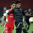Sporting's Argentinian defender Jonathan Silva (R) vies with Skenderbeu's Albanian defender Kristi Vangjeli (L) during the UEFA Europa League football match between KF Skenderbeu ans Sporting Clube de Portugal at the Elbasan Arena stadium in Elbasan on November 5, 2015. AFP PHOTO / GENT SHKULLAKU