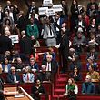 Members of parliament from the left-wing coalition NUPES (New People's Union for Ecological Society) hold up placards during a speech by French Prime Minister Elisabeth Borne (left) to force pension laws without a parliamentary vote during the government's session on pensions. Make sure.  Reform at the House of Representatives National Assembly in Paris on March 16, 2023.  - The French president enforced the pension law without a parliamentary vote after gaining Senate approval to reform the pension system. Strike from the beginning of the year.  (Photo: Alain Jocard/AFP)