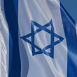 ARCHIVE - April 28, 2018, Brandenburg, Schönefeld: The flag of Israel consists of a centrally located blue Star of David between two horizontal blue stripes on a white background.  With a festival on the Gendarmenmarkt on Friday (3 p.m.), Berlin commemorates the founding of Israel 70 years ago.  (to dpa 