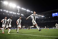 Juventus' Portuguese forward Cristiano Ronaldo (R) celebrates after scoring 3-0 during the UEFA Champions League round of 16 second-leg football match Juventus vs Atletico Madrid on March 12, 2019 at the Juventus stadium in Turin. (Photo by Marco BERTORELLO / AFP)