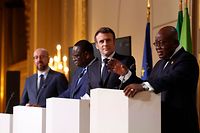 French President Emmanuel Macron (2-R), flanked by Ghana's President Nana Afuko Addo (R), Senegal's President Macky Sall (2-L), and European Council President Charles Michel (L), holds a joint press conference on France's engagement in the Sahel region, at the Elysee Palace in Paris on February 17, 2022. - France announced on February 17, 2022, that it was withdrawing troops from Mali due to a breakdown in relations with the ruling junta, after nearly 10 years of fighting a jihadist insurgency. The Mali deployment has been fraught with problems for France. Of the country's 53 soldiers killed serving in West Africa, 48 of them died in Mali. (Photo by Ian LANGSDON / POOL / AFP)