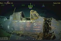 This handout photograph obtained March 5, 2018 courtesy of Paul G. Allen shows wreckage from the USS Lexington, a US aircraft carrier which sank during World War II, that has been found in the Coral Sea, a search team led by Microsoft co-founder Paul G. Allen announced March 5, 2018.  
The wreckage was found March 4, 2018 by the team's research vessel, the R/V Petrel, some 3,000 meters (two miles) below the surface more than 500 miles (800 kilometers) off the eastern coast of Australia. Remarkably preserved aircraft could be seen on the seabed bearing the five-pointed star insignia of the US Army Air Forces on their wings and fuselage.  / AFP PHOTO / PAUL G. ALLEN / STR / == RESTRICTED TO EDITORIAL USE  / MANDATORY CREDIT:  "AFP PHOTO /  HO / COURTESY OF PAUL G. ALLEN" / NO MARKETING / NO ADVERTISING CAMPAIGNS /  DISTRIBUTED AS A SERVICE TO CLIENTS  ==
