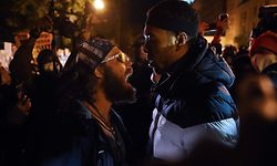 TOPSHOT - A US President Donald Trump supporter (L) clashes with a demonstrator at Black Lives Matter plaza across from the White House on election day in Washington, DC on November 3, 2020. (Photo by Olivier DOULIERY / AFP)