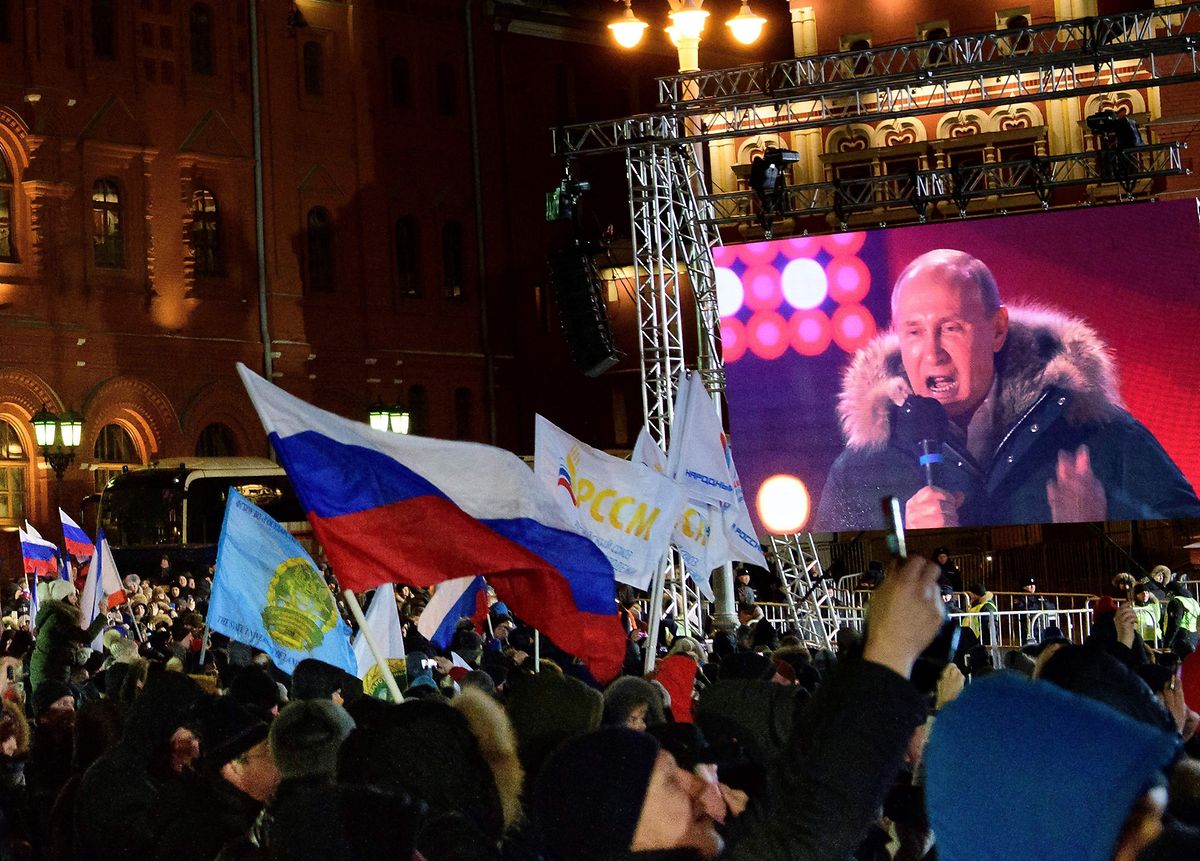 President Vladimir Putin addresses the crowds at Manezhnaya Square in Moscow (AFP)