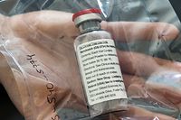 (FILES) In this file photo one vial of the drug Remdesivir is viewed during a press conference about the start of a study with the Ebola drug Remdesivir in particularly severely ill patients at the University Hospital Eppendorf (UKE) in Hamburg, northern Germany on April 8, 2020, amidst the new coronavirus COVID-19 pandemic. - Gilead Science's remdesivir, one of the most highly anticipated drugs being tested against the new coronavirus, showed positive results in a large-scale US government trial, the company said on april 29, 2020."We understand that the trial has met its primary endpoint and that NIAID (National Institute of Allergy and Infectious Diseases) will provide detailed information at an upcoming briefing," the company said. (Photo by Ulrich Perrey / POOL / AFP)