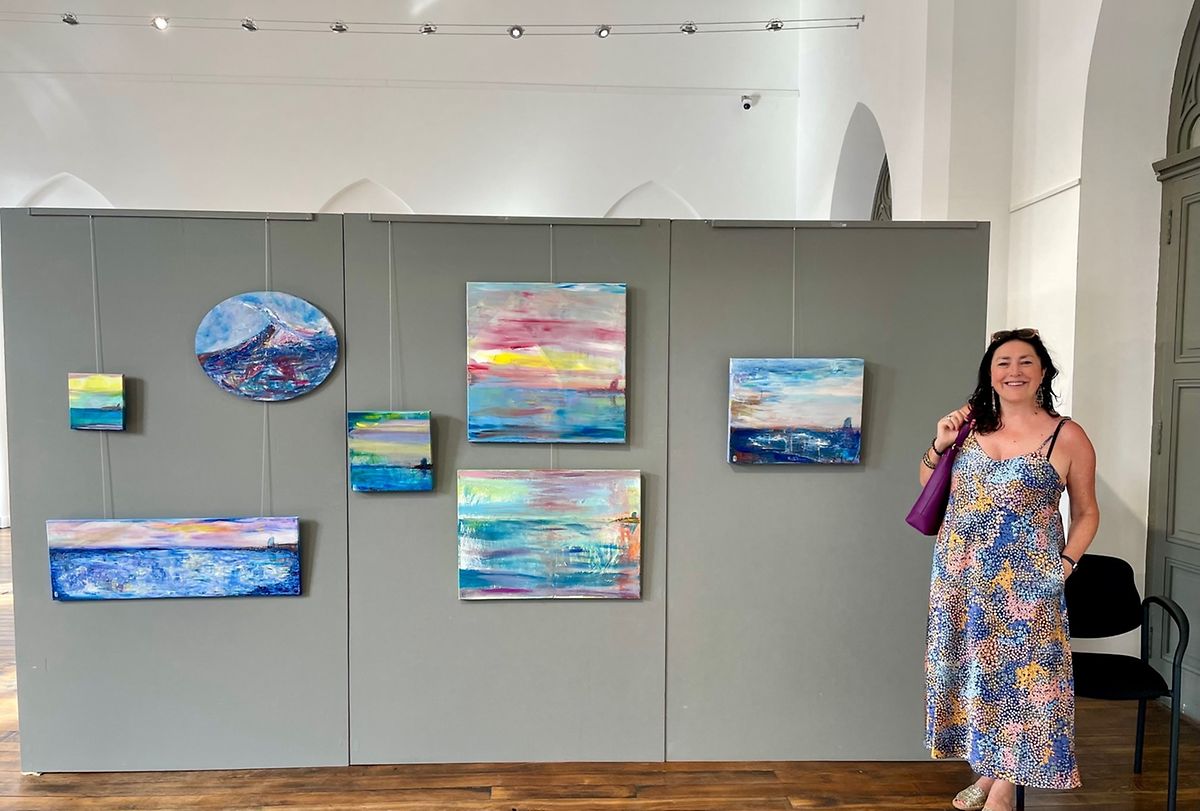 Anna paints colourful abstract landscapes, often featuring the sea