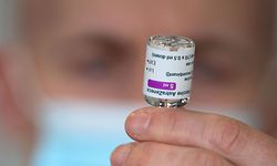 A member of the Hampshire Fire and Rescue Service prepares a dose of a AstraZeneca/Oxford Covid-19 vaccine at a temporary vaccination centre set up at Basingstoke Fire Station, in Basingstoke, Hampshire, southern England, on February 4, 2021, as crews continue to take 999 emergency calls. - Oxford University announced on Thursday it will launch a medical trial alternating doses of Covid-19 vaccines created by different manufacturers, the first study of its kind. (Photo by Andrew Matthews / POOL / AFP)