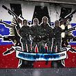 This photo shows a defaced mural glorifying readings by the Russian mercenary group Wagner. "Wagner Group - Russian Knights" On the side wall of an apartment building in Belgrade on January 20, 2023.  (Photo by OLIVER BUNIC / AFP)