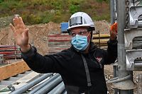 A construction worker wearing protective masks works on April 28, 2020, at a parking construction site in Chambery, eastern France, on the 43rd day of a lockdown in France aimed at curbing the spread of the COVID-19 disease, caused by the novel coronavirus. - Construction companies adapted a large sanitary rules due to the COVID-19 pandemic caused by the novel coronavirus. (Photo by PHILIPPE DESMAZES / AFP)