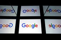 (FILES) In this file photo taken on February 16, 2019 this illustration picture shows the US  multinational technology and Internet-related services company Google logo displayed on a tablet in Paris. - Google parent Alphabet reported a rare drop in revenue and profit on July 30, 2020, in a quarterly update that nonetheless topped market expectations. (Photo by Lionel BONAVENTURE / AFP)