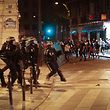 French riot police take position near the Arc de Triomphe after the Euro 2016 final football match between France and Portugal on the Champs Elysees in Paris, on July 10, 2016.
Star striker Cristiano Ronaldo devoted Portugal's Euro 2016 triumph over France on Sunday to "all Portuguese and all immigrants". / AFP PHOTO / GEOFFROY VAN DER HASSELT