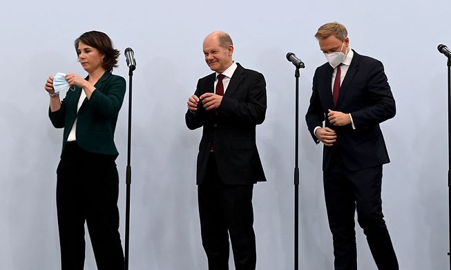 Green leader Annalena Baerbock, Social Democrat Olaf Scholz and Free Democrats leader Christian Lindner