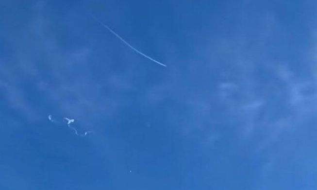This still image taken from a cellphone video by Haley Walsh in Myrtle Beach, South Carolina, shows an alleged Chinese surveillance balloon after it was shot down (loser L) on 4 February, 2023
