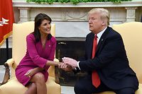(FILES) In this file photo taken on October 09, 2018, US President Donald Trump shakes hands with Nikki Haley, the United States Ambassador to the United Nations, in the Oval office of the White House. - Haley announced on February 14, 2023, she is running for president in 2024, challenging fellow Republican candidate Donald Trump by proposing a "new generation" of leadership in Washington. (Photo by Olivier Douliery / AFP)
