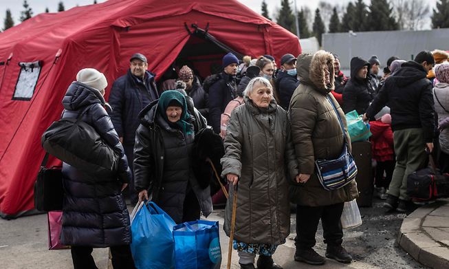 Refugees from Ukraine are seen as they arrive at the border crossing in Korczowa, Poland, March 2, 2022. -